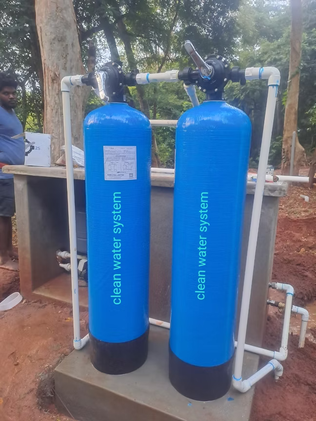 Clean Water System branded softener tanks installed outdoors
