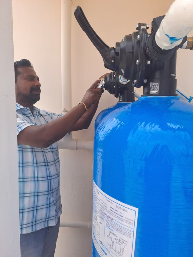Technician fine-tuning a control valve