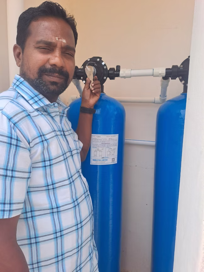 Technician with a completed installation